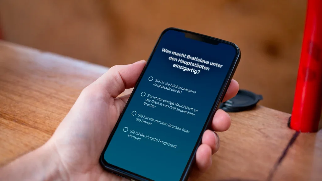 Quizfrage auf einem Mobiltelefon während der Bratislava Bike Team Challenge Ride mit Avemeo
