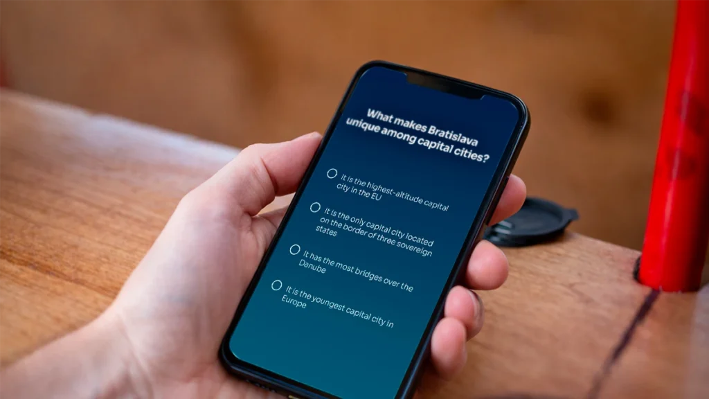 Quiz question on a mobile phone during the Bratislava Bike Team Challenge Ride powered by Avemeo