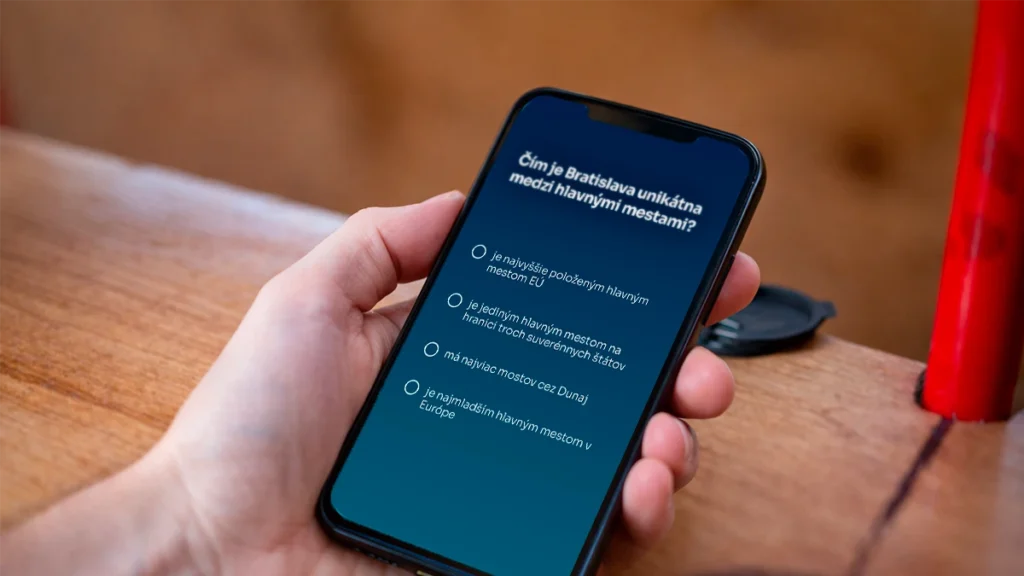 Kvízová otázka na mobile počas jazdy Bratislava Bike Tímová výzva cez Avemeo